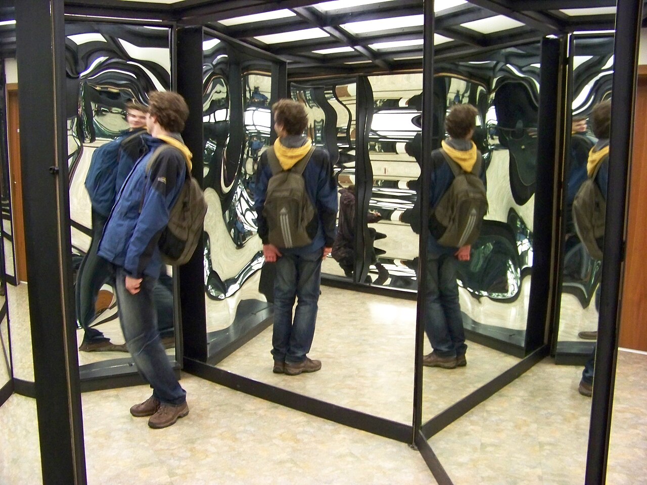 mirror maze with mirrored walls and reflections at a funfair attraction