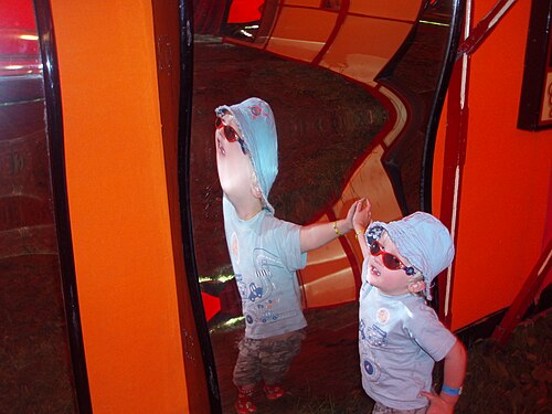 House of mirrors attraction at Carters Steam Fair with maze-like mirrored panels